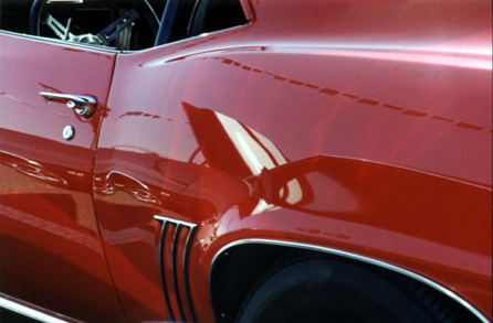 Red 1969 Chevy Camaro shined by Zaino
